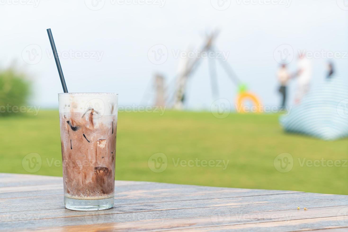 ice chocolate milkshake on table photo