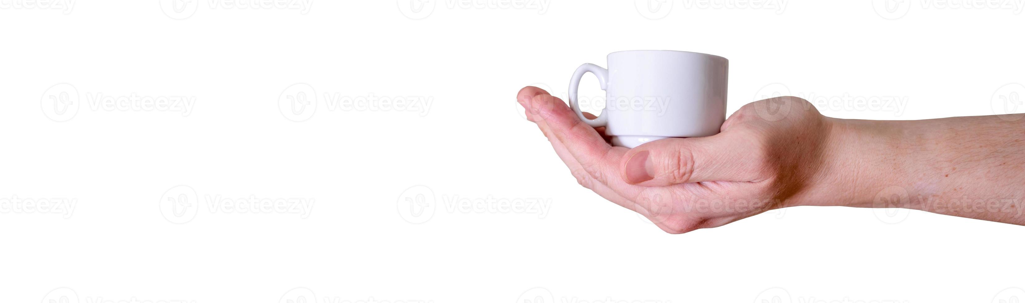Man holding a white cup of espresso coffee on a white background. photo