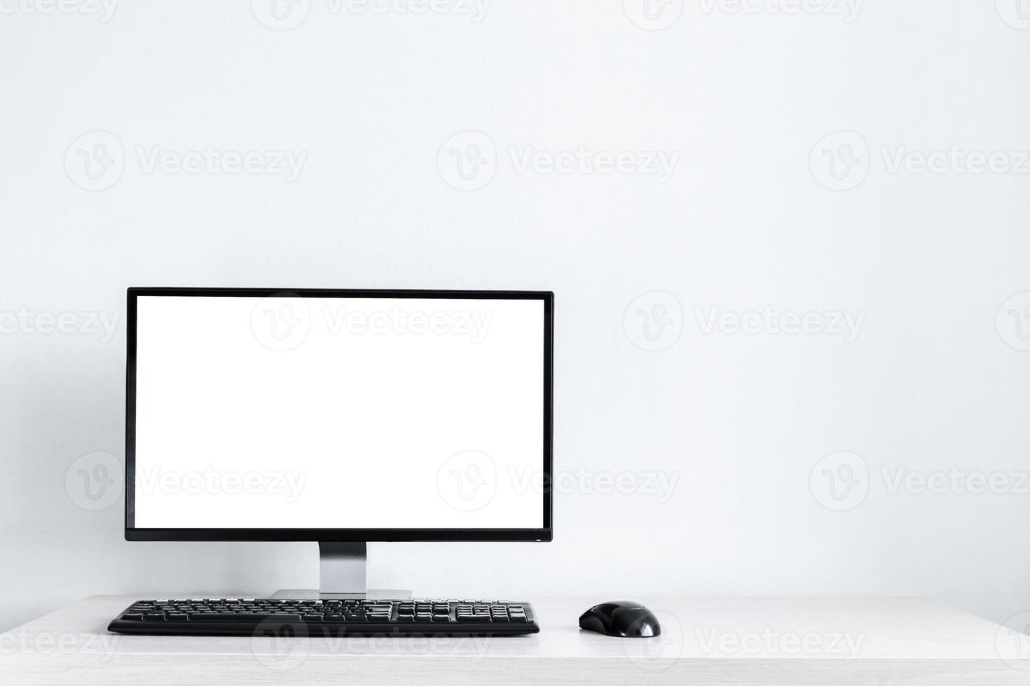 Mockup A modern desktop computer shows a blank screen on the desk photo