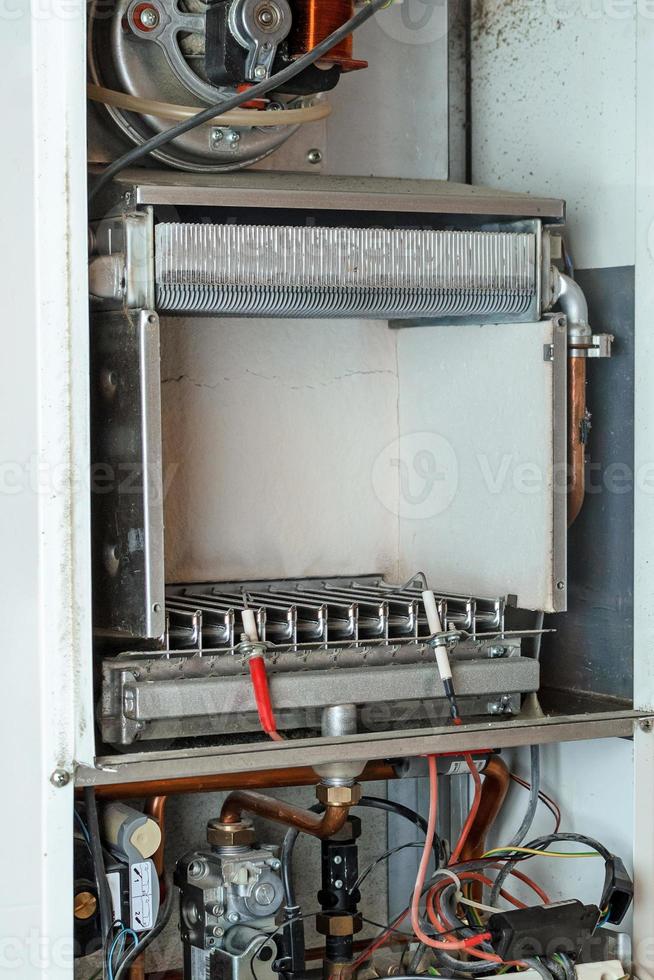 internal view of the part of the automatic built-in gas boiler in the house. photo