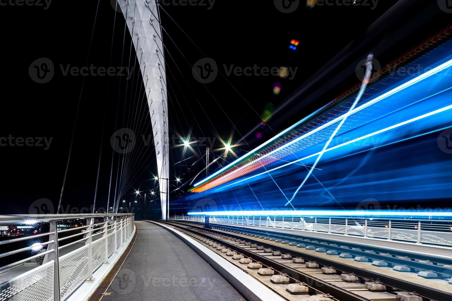 Citadelle Bridge across Bassin Vauban for trams and bicycles. Night view. photo