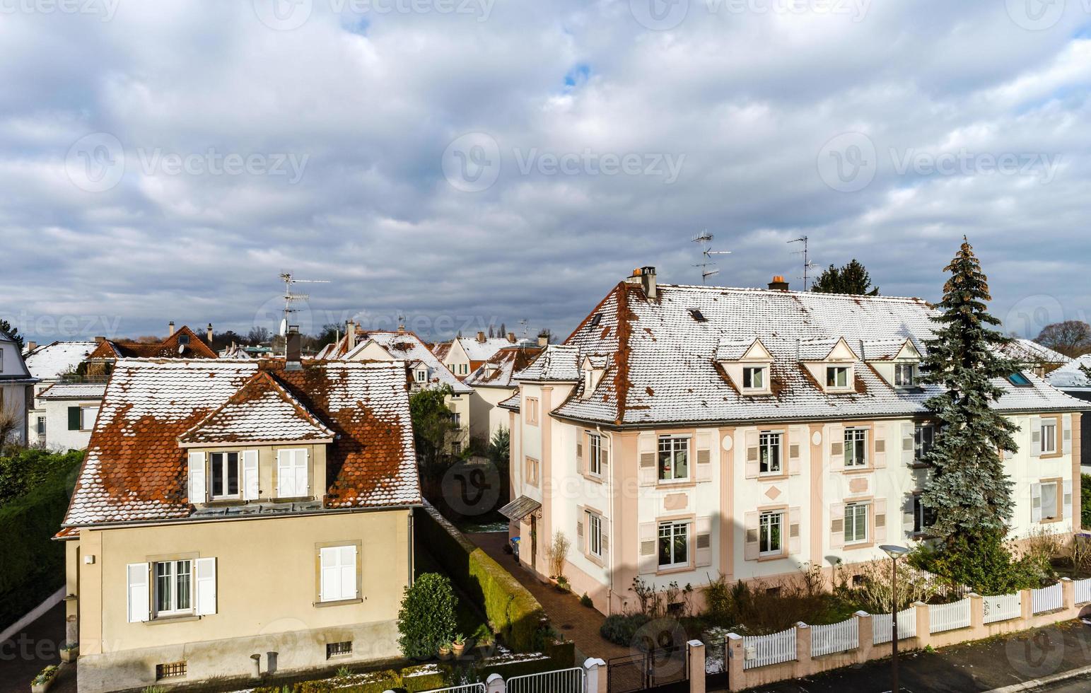 Snow on the roofs, overview. Strasbourg spring time photo