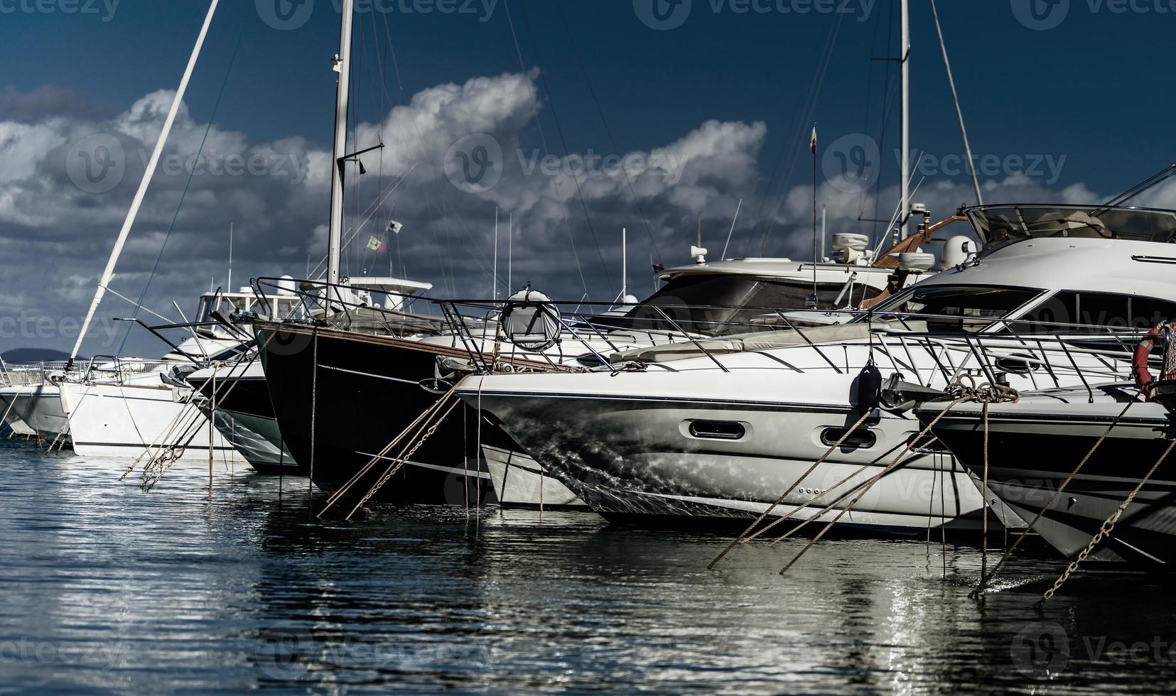 Harbor of big yachts in mediterranean sea, Tuscany photo