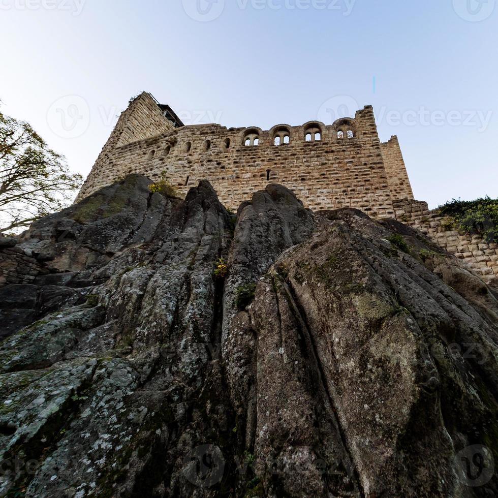 Old medieval hilltop castle Bernstein in Alsace. The ruins of a historic fort are built on a cliff. photo