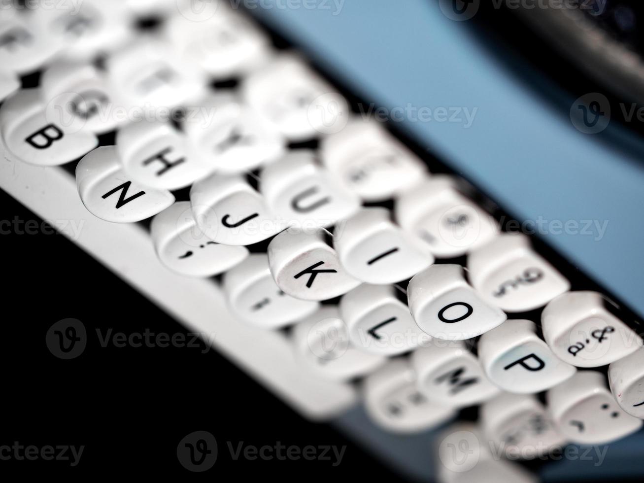 Vintage typewriter, writer or author's tool, inspiration and creativity. On a black background. photo