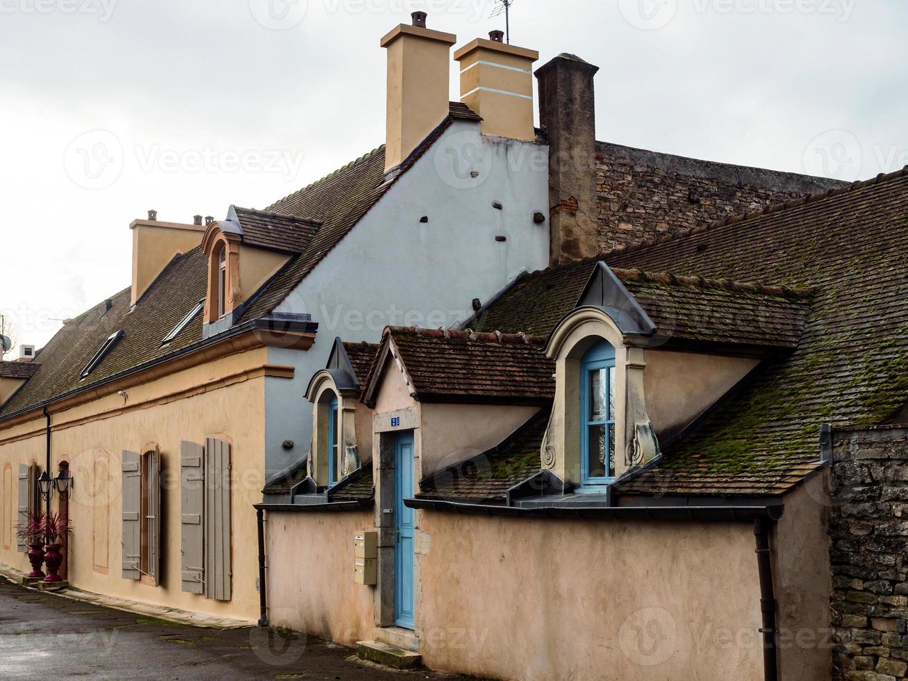Beautiful ancient architecture of Burgundy. Streets of the city of Beaune. Sunny spring day. Advertising tourist types. photo