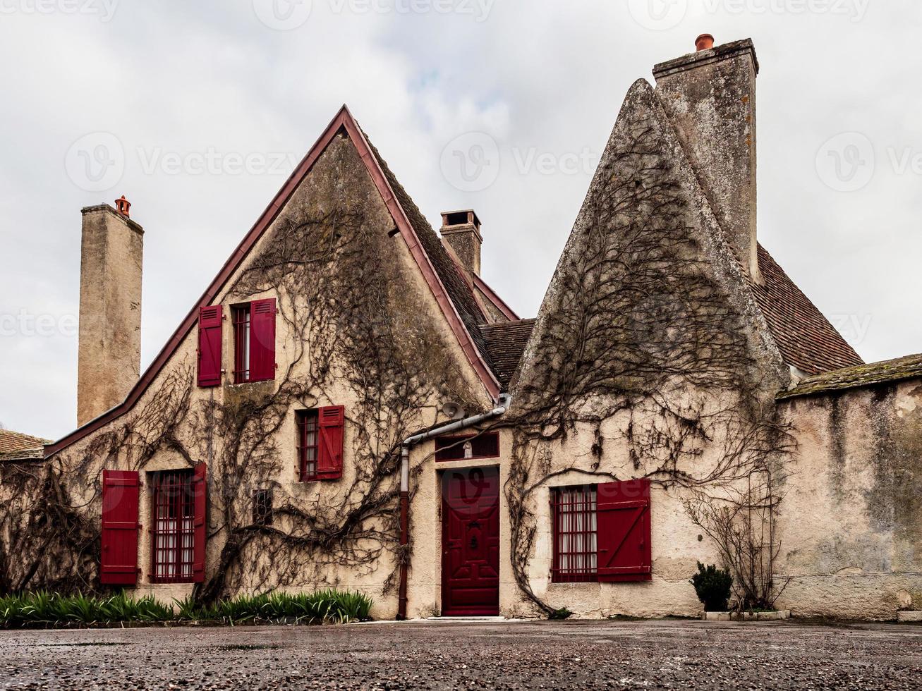 Beautiful ancient architecture of Burgundy. Streets of the city of Beaune. Sunny spring day. Advertising tourist types. photo