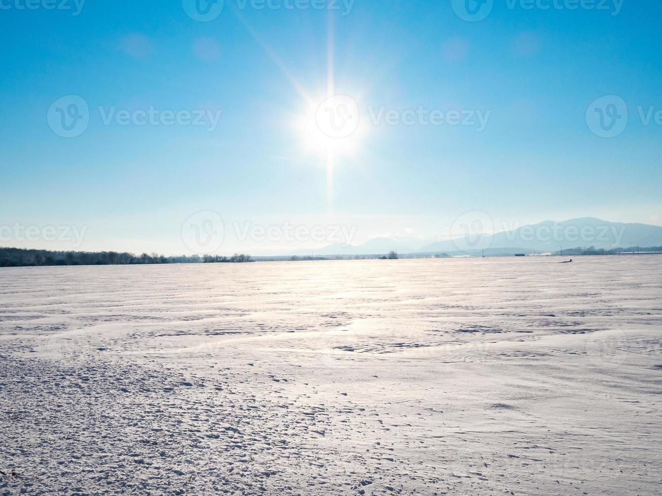 Snow-covered white fields in Alsace, top view. White desert. photo