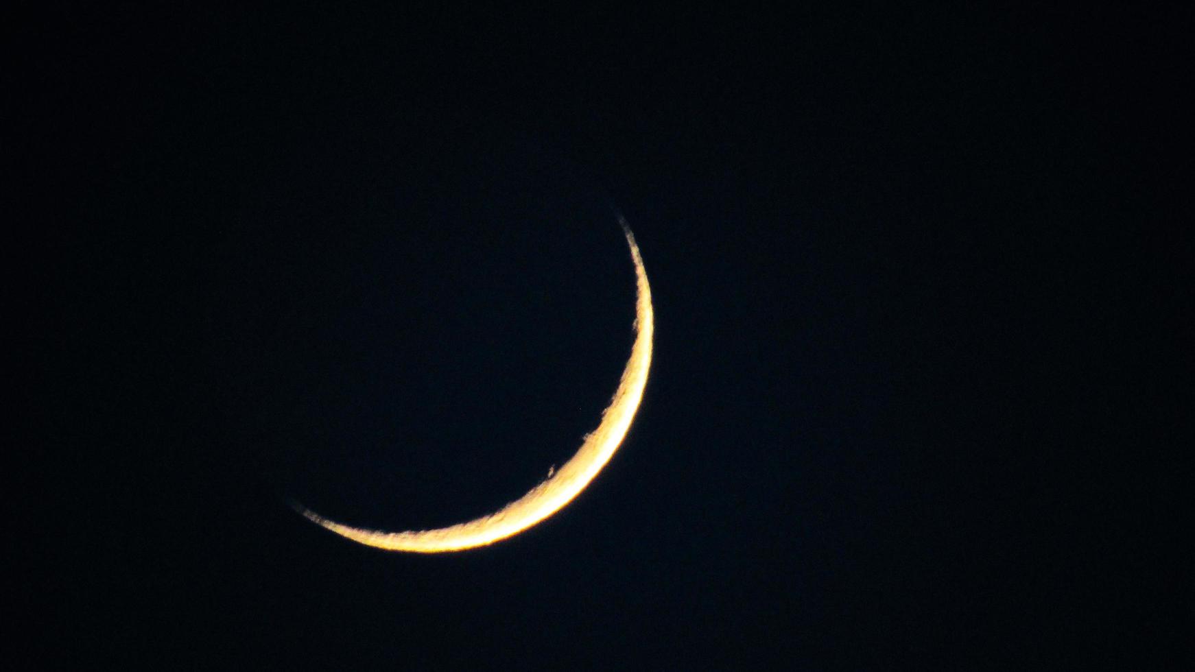 moon sickle in the night sky photo