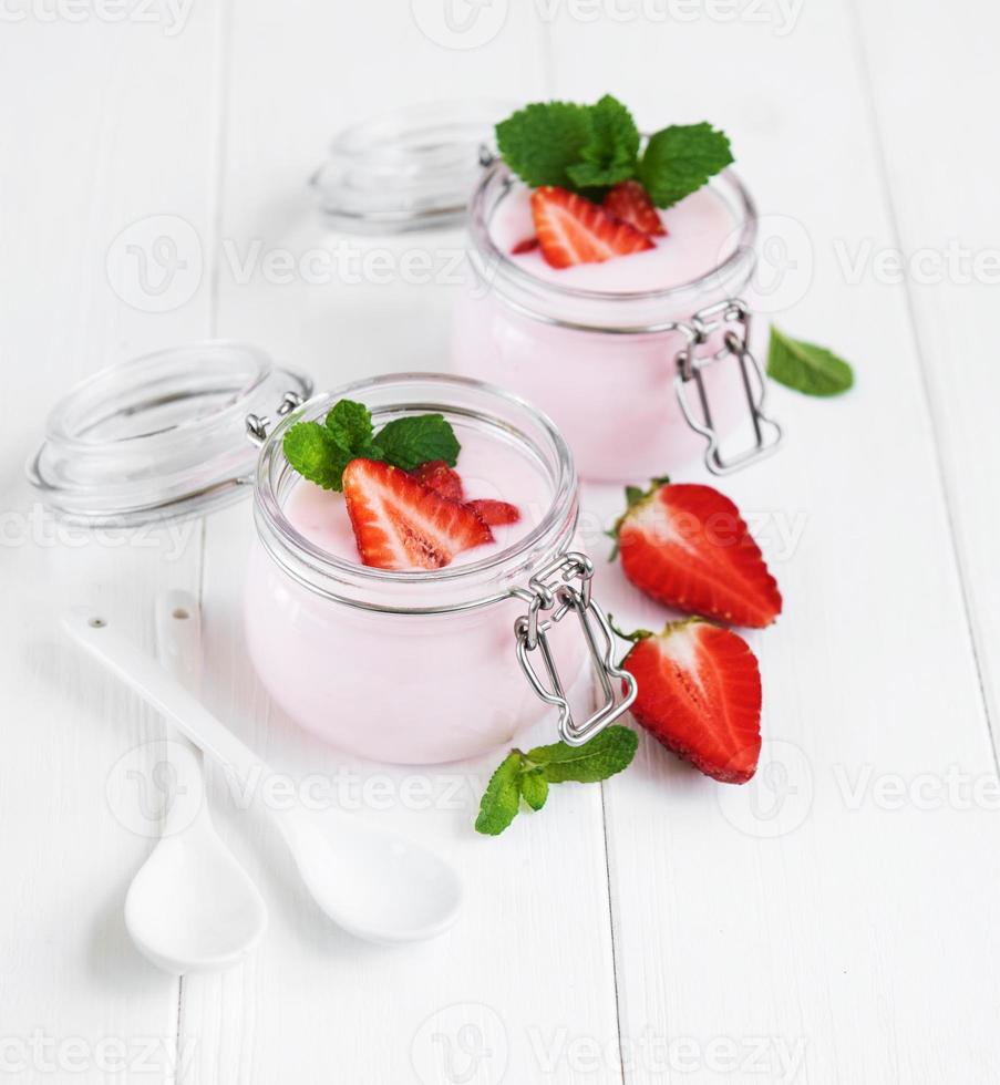 Jars with strawberry yogurt photo