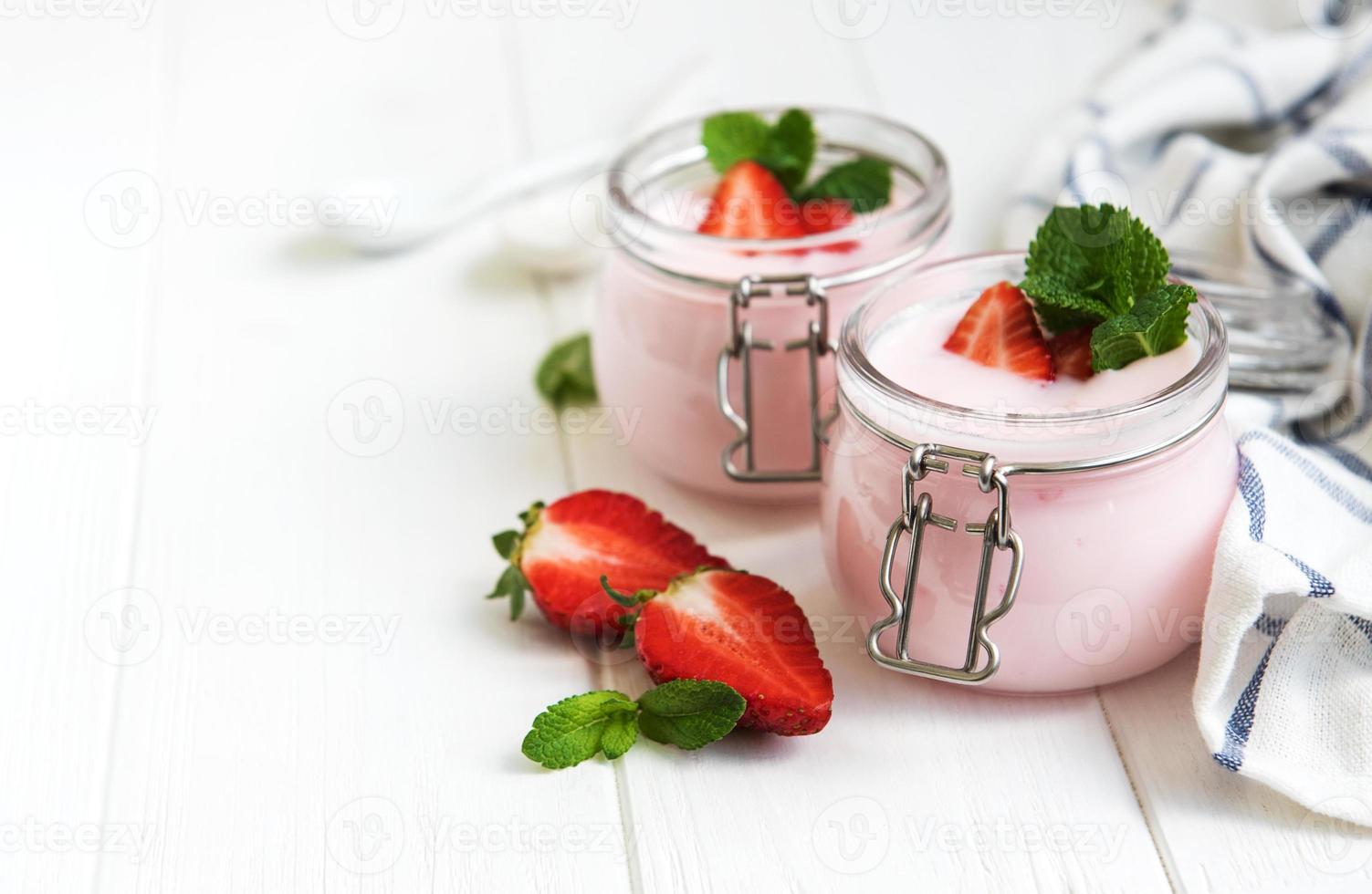 Jars with strawberry yogurt photo