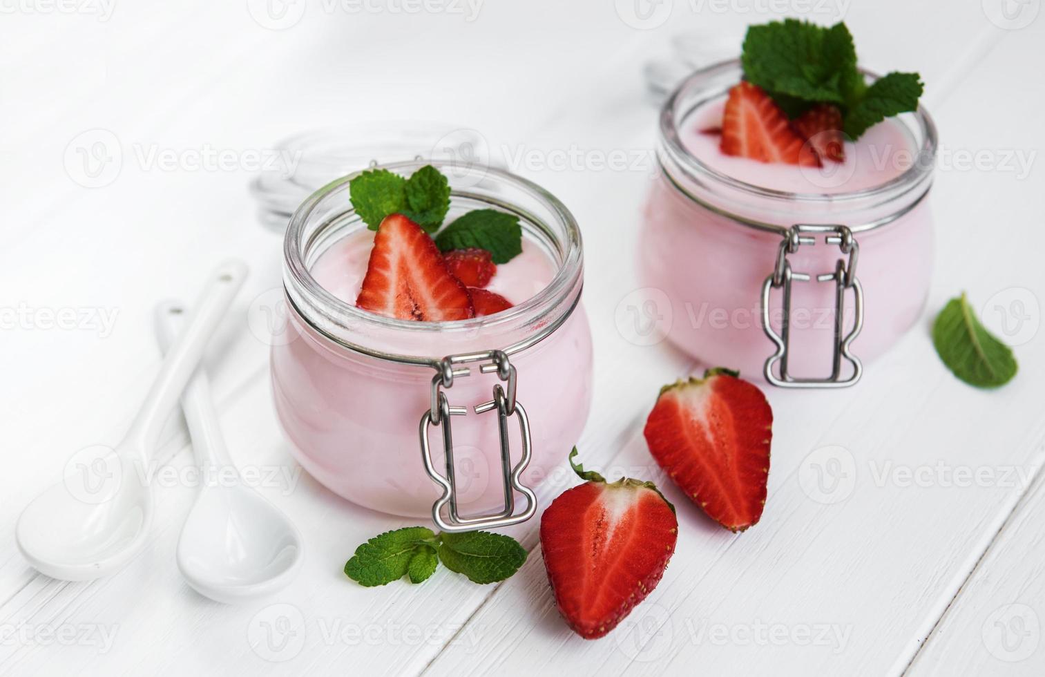 Jars with strawberry yogurt photo