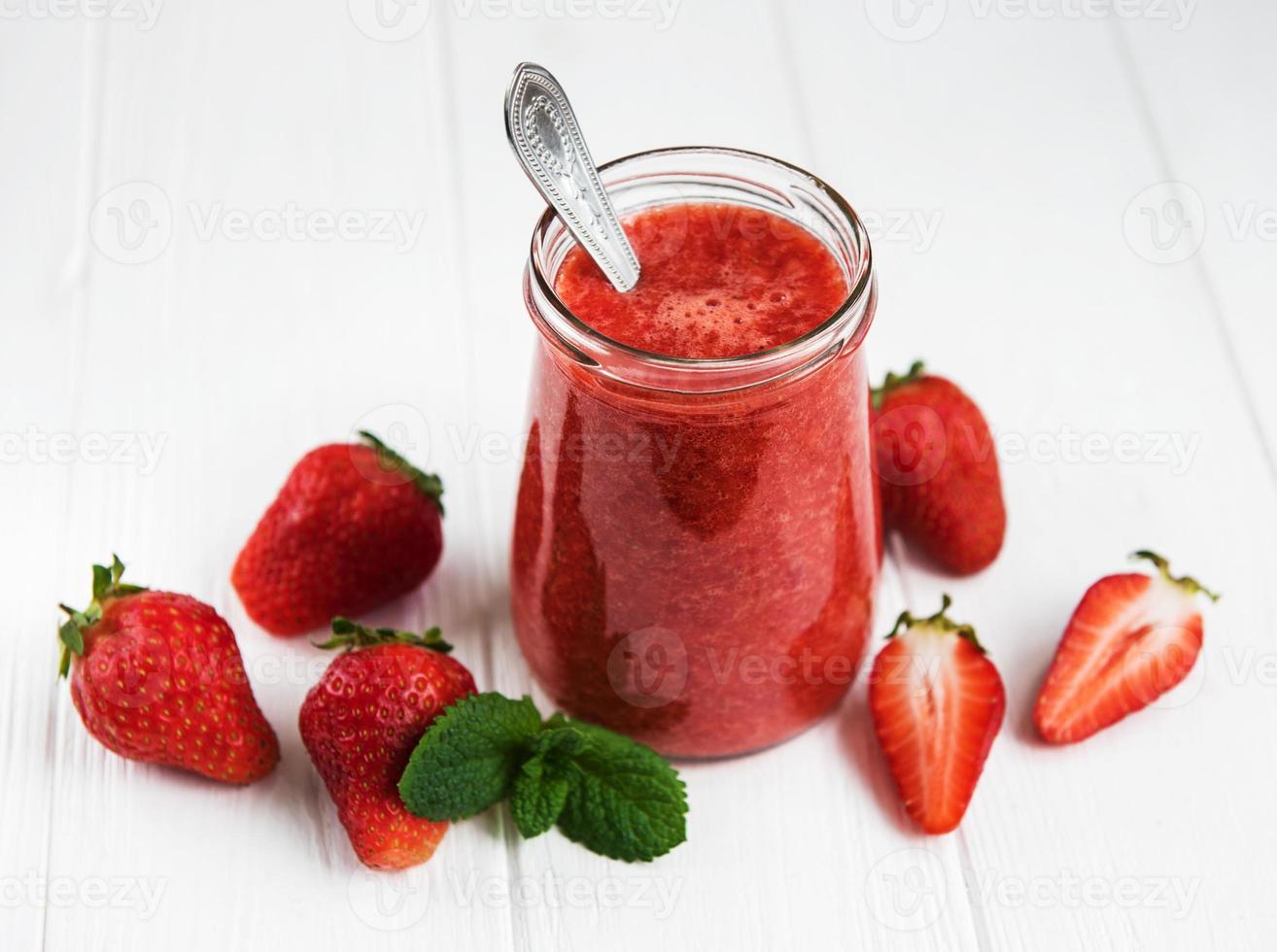 Jar with strawberry smoothie photo