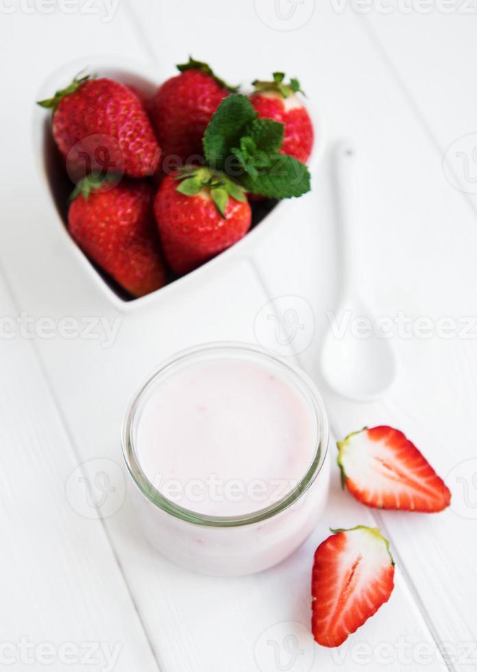 Jar with strawberry yogurt photo