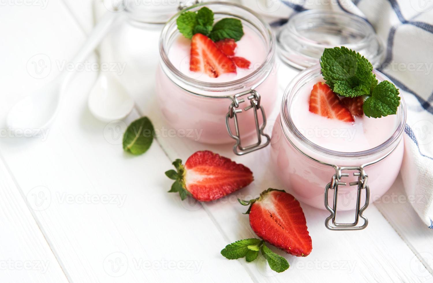 Jars with strawberry yogurt photo