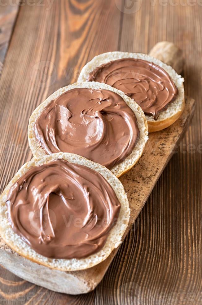 Slices of bread with chocolate paste photo