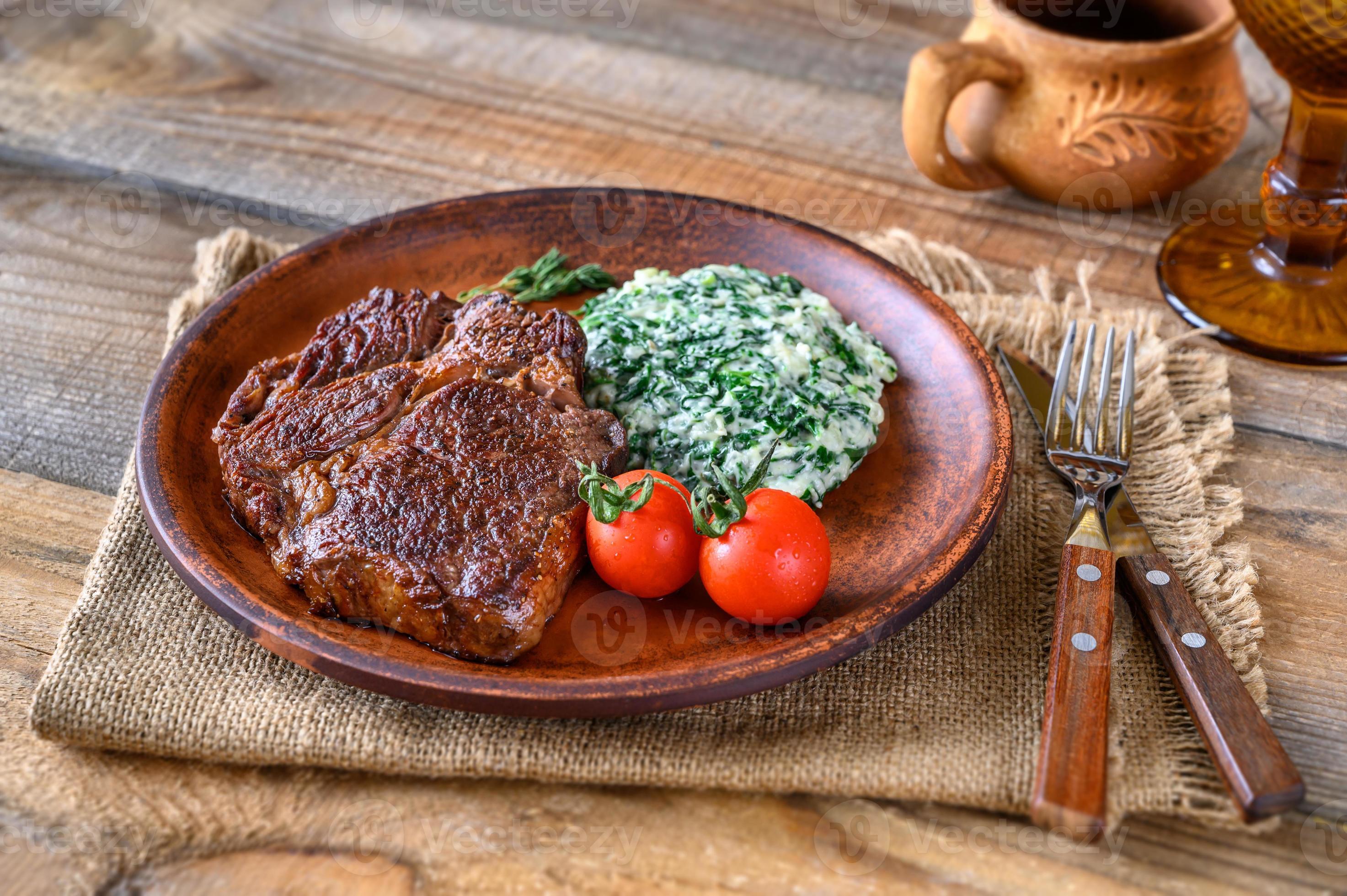 Beef steak with creamy spinach 5463025 Stock Photo at Vecteezy