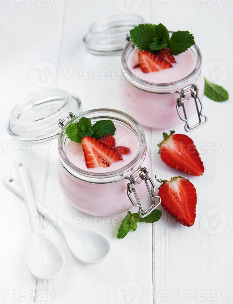 Jars with strawberry yogurt photo