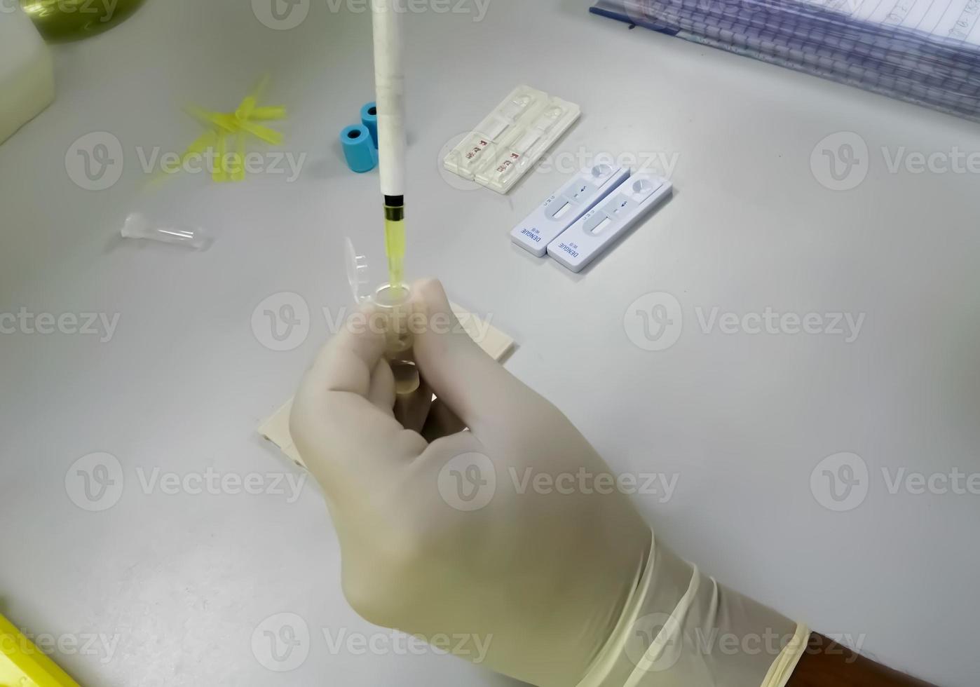 Technician working on laboratory. Serological testing photo