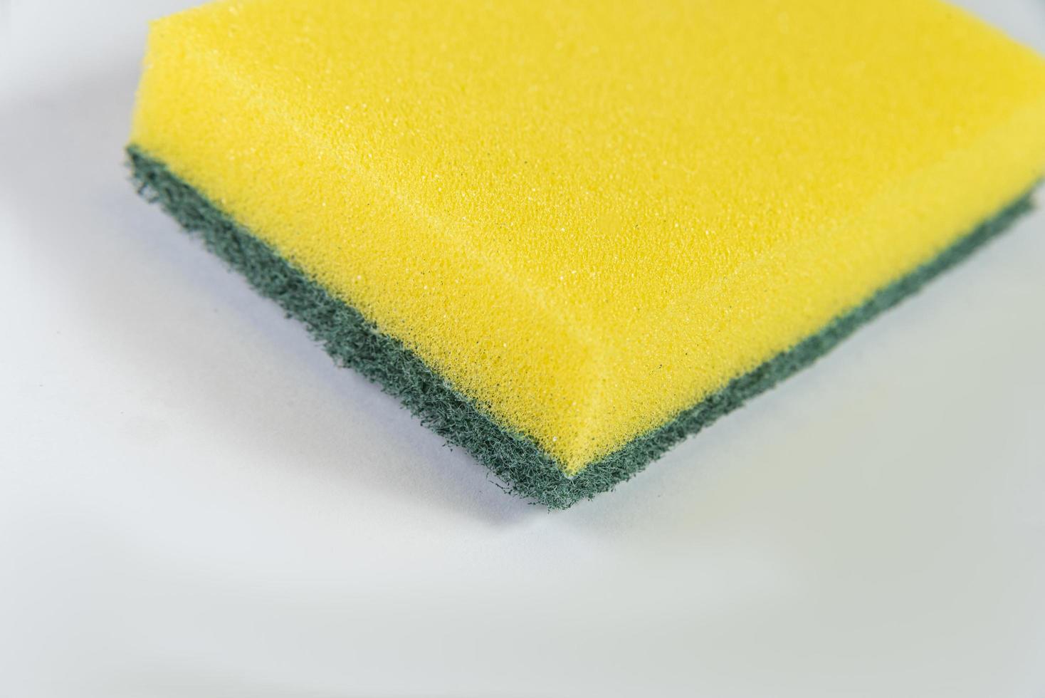 Kitchen sponge on the white background photo