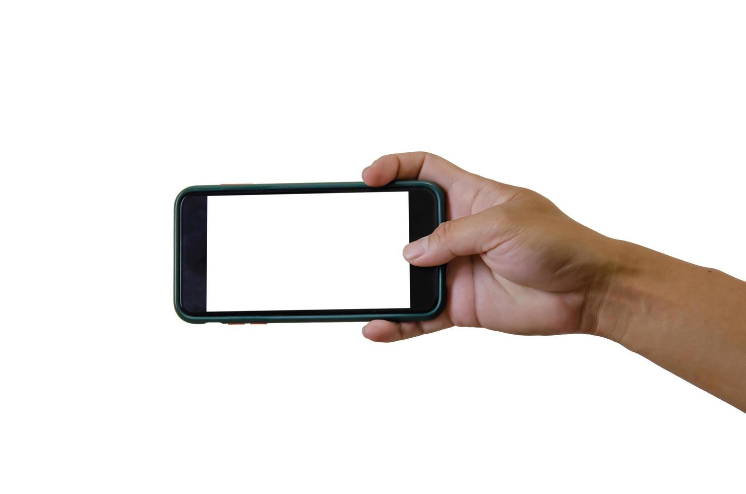 Hand holding a smartphone on a white background. White blank phone screen. photo