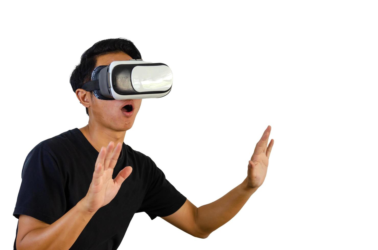 Virtual Experience. Excited Wearing VR Headset, Touching Air While Playing Video Game on white background. photo