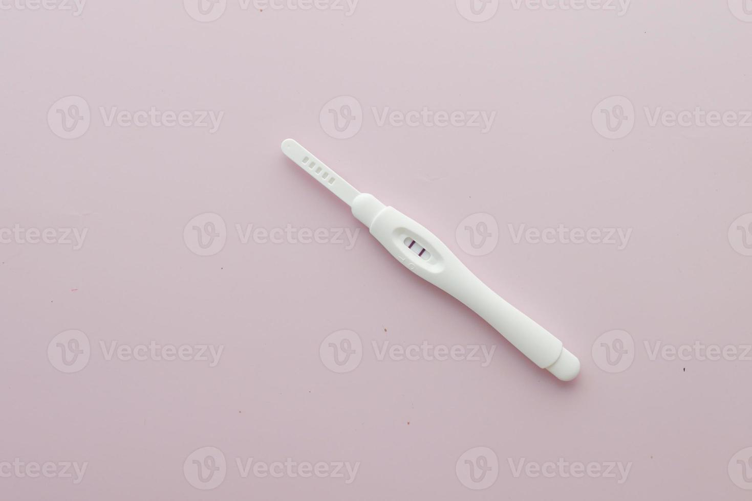 top view of Pregnancy test kit on light purple background photo