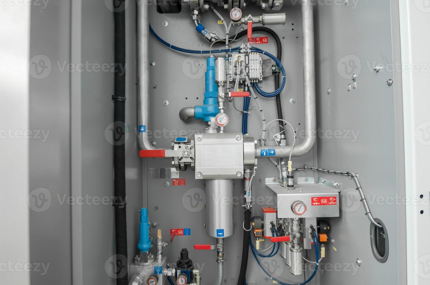 control valves and taps in a metal shield photo