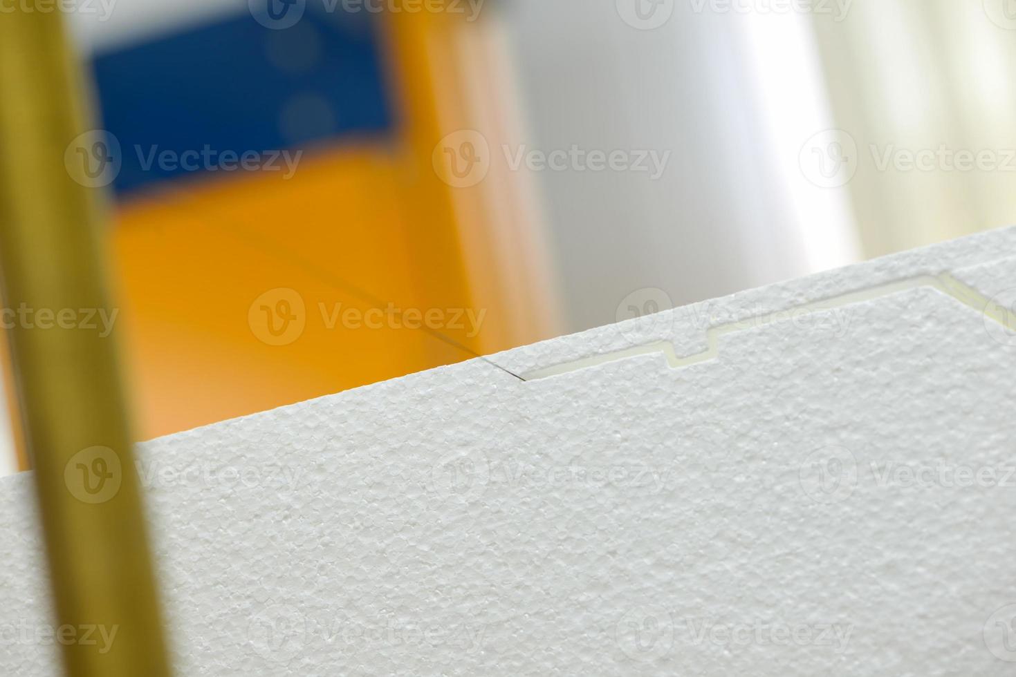 The machine cuts foam plastic. Plant for the production of sandwich panels from styrofoam photo