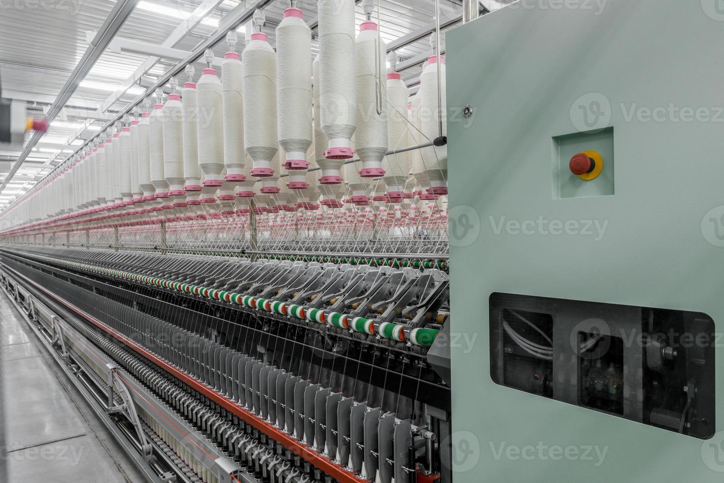 Machinery and equipment in the workshop for the production of thread. Industrial textile factory photo