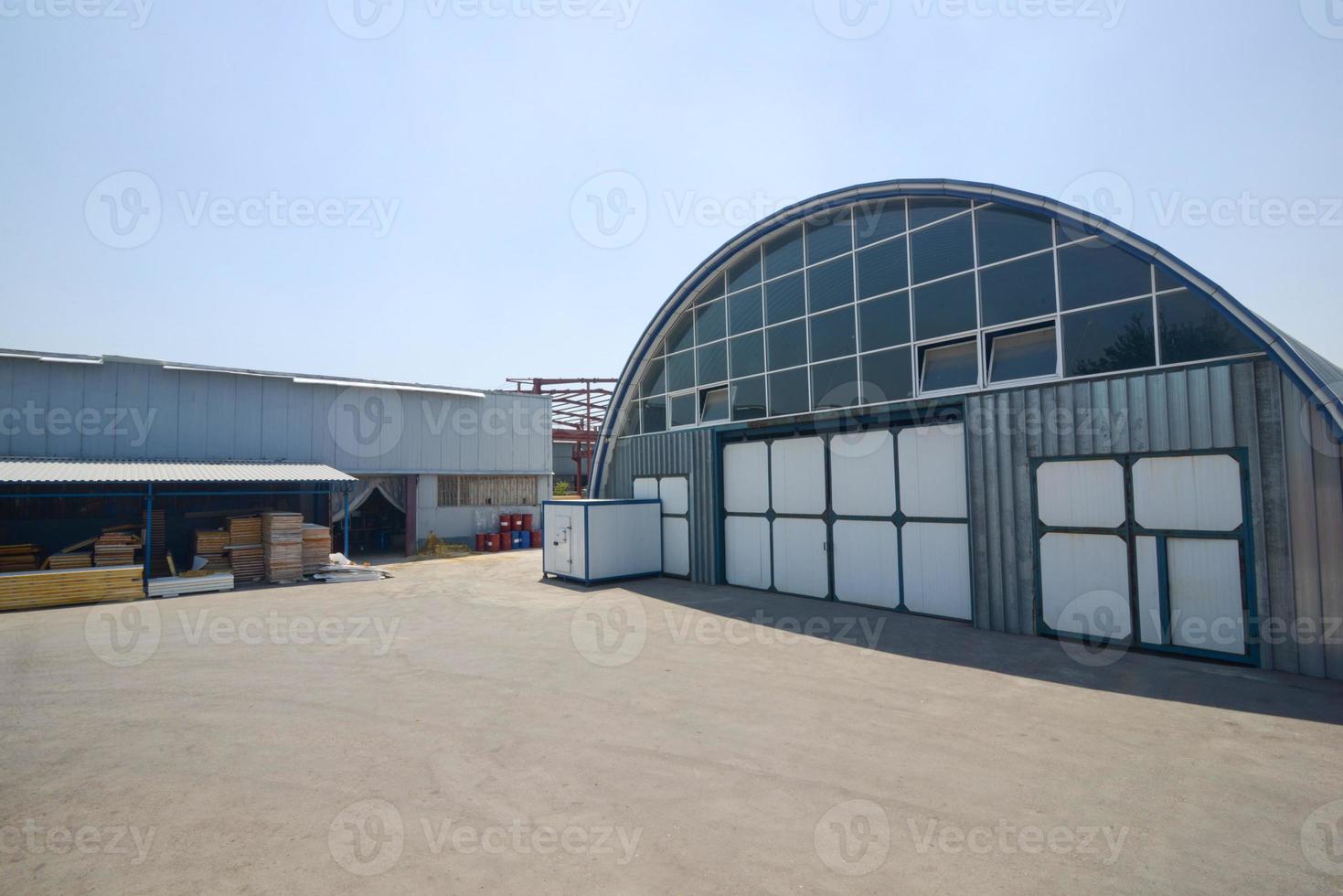 facade of an industrial warehouse with an oval roof photo