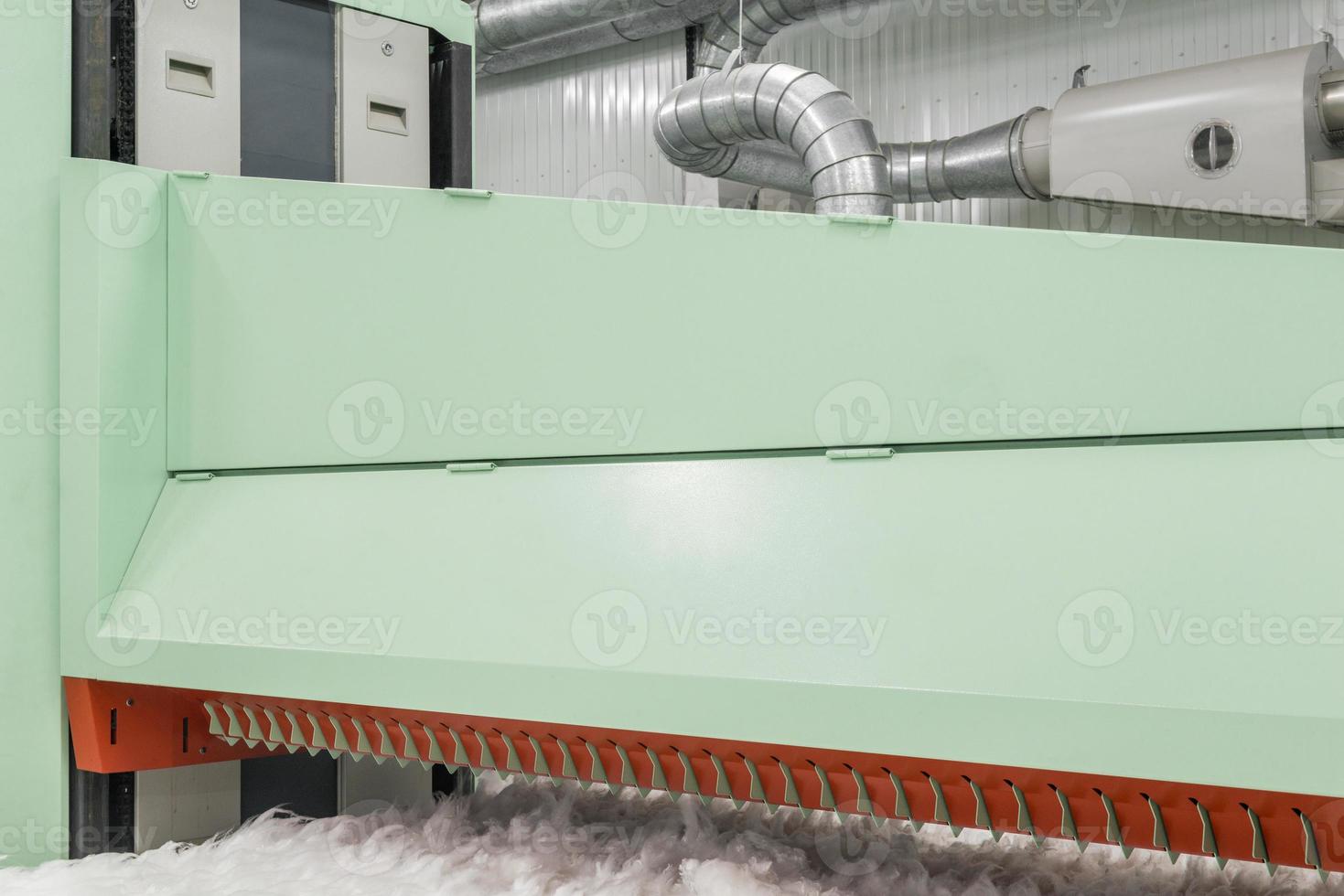 carding machine in spinning workshop. equipment and technologies at the textile factory photo