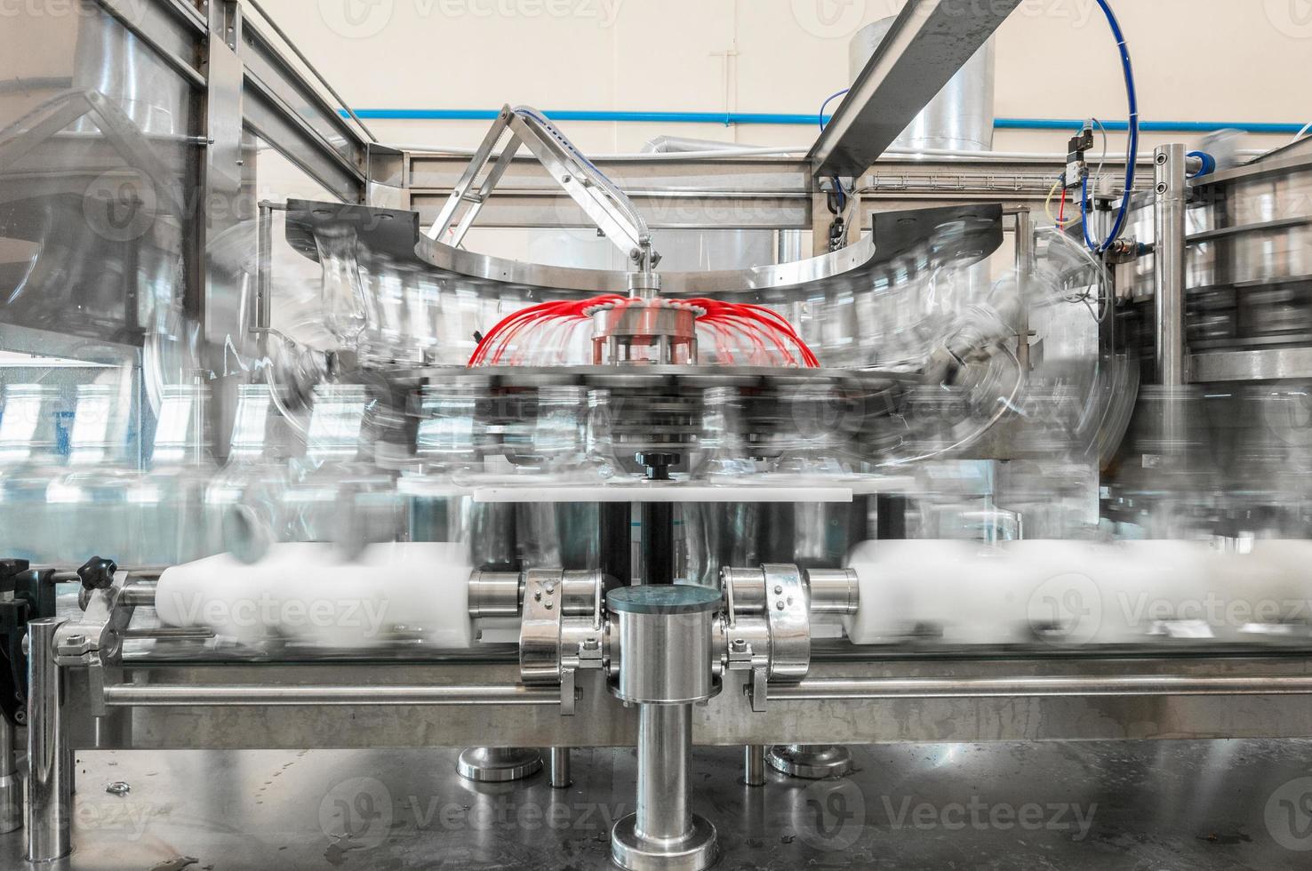 on the conveyor belt glass bottles. factory for the production of glass bottles and beverage photo