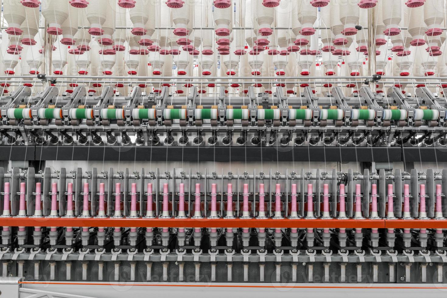Machinery and equipment in the workshop for the production of thread. Industrial textile factory photo
