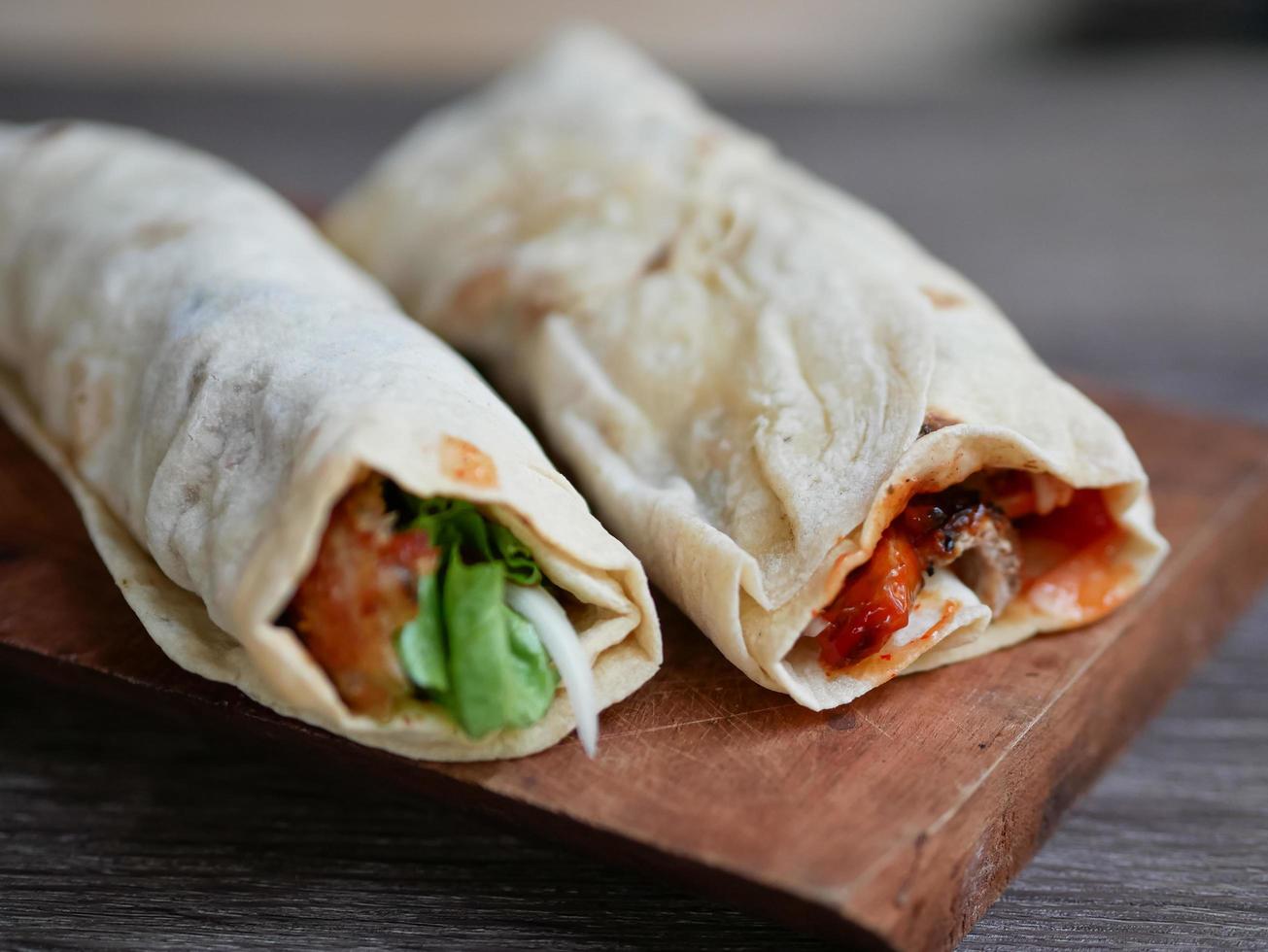 kebab on a wooden cutting board. soft focus photo