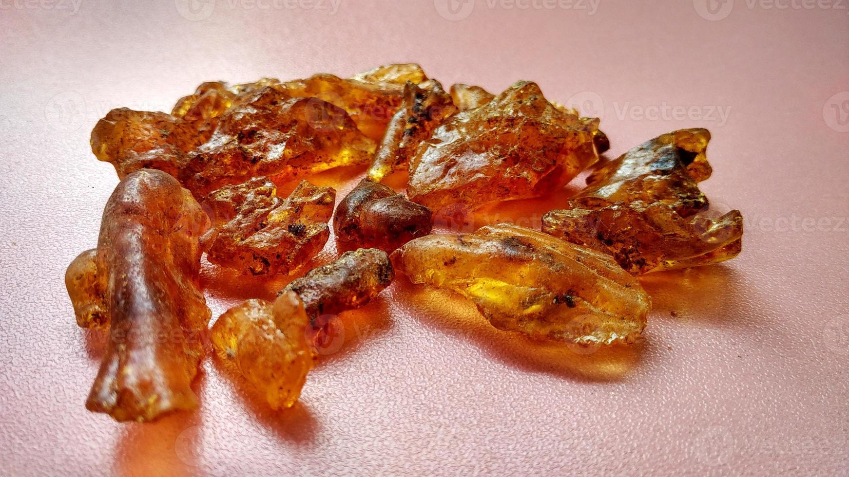 Resin sap is a natural sap from the Agathis borneensis tree, yellow light from central java, Indonesia photo