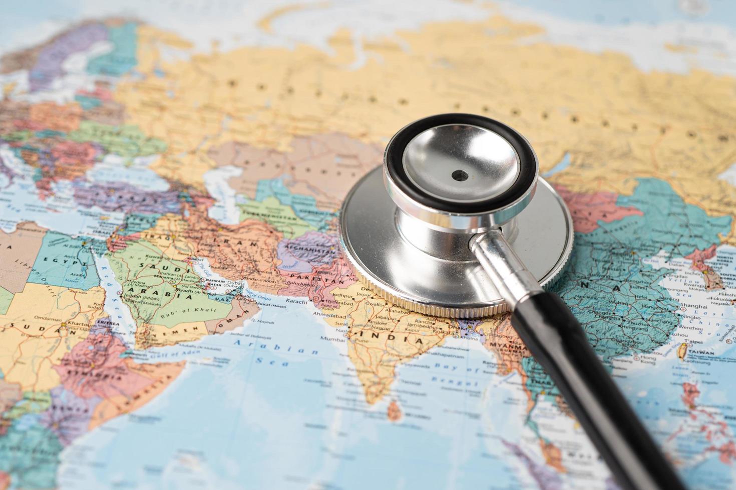 Bangkok, Thailand - June 1, 2020, Stethoscope on Asia world globe map background. photo