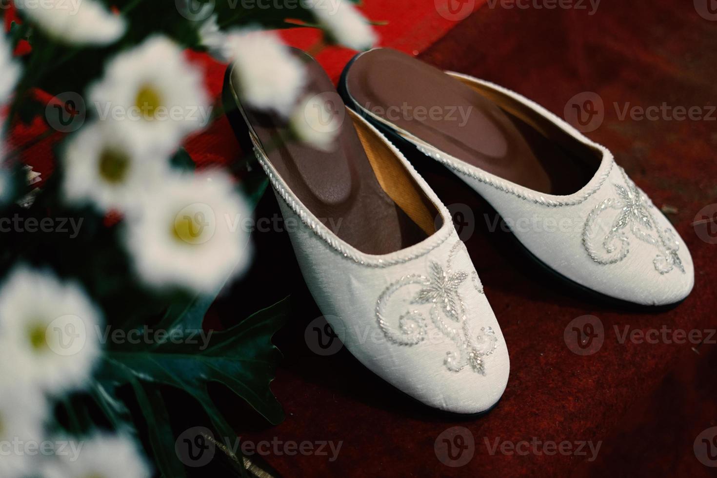 Elegant white wedding shoes photo