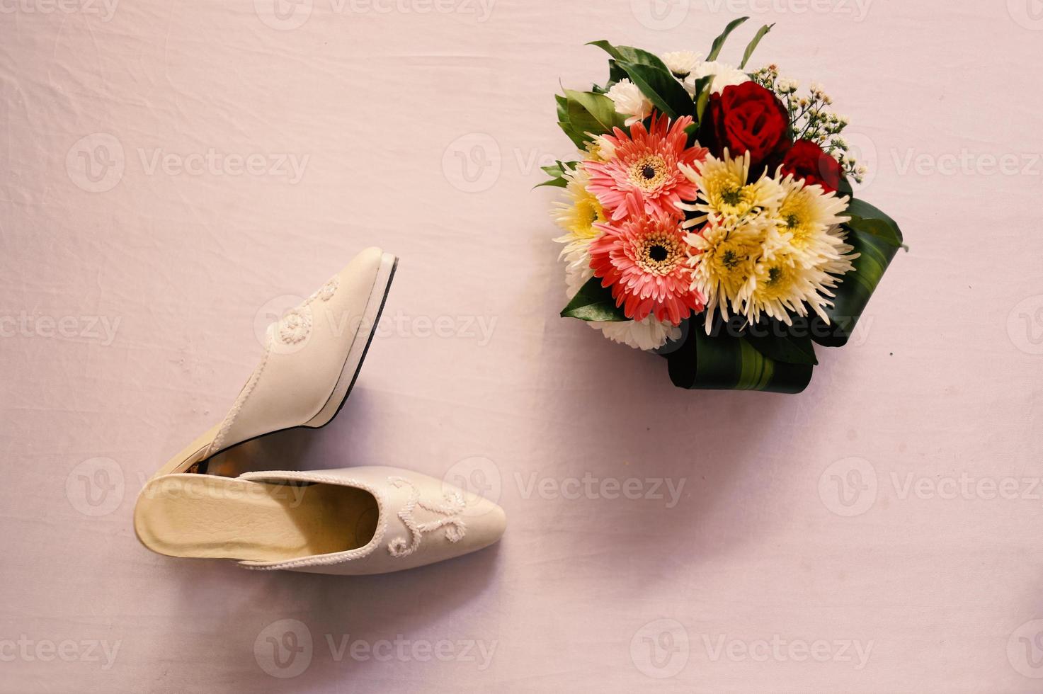 Elegant white wedding shoes photo