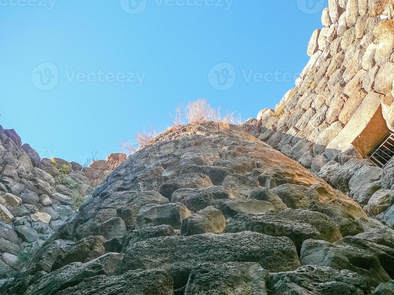 Ruins of ancient Sunuxi Nuraghe megalithic building in Sardinia, photo