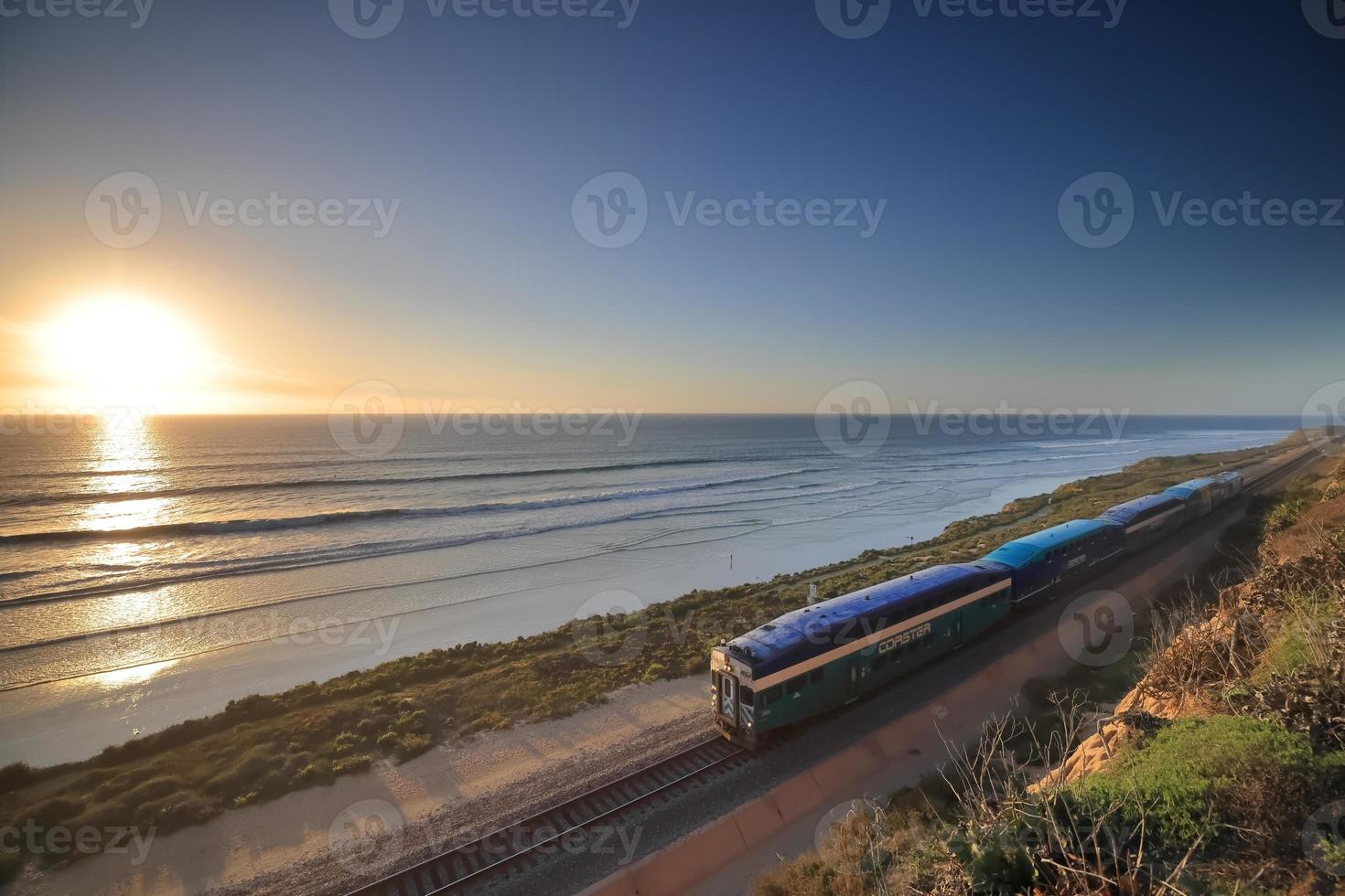 Amtrak trains along the San Diego coastline at dusk photo
