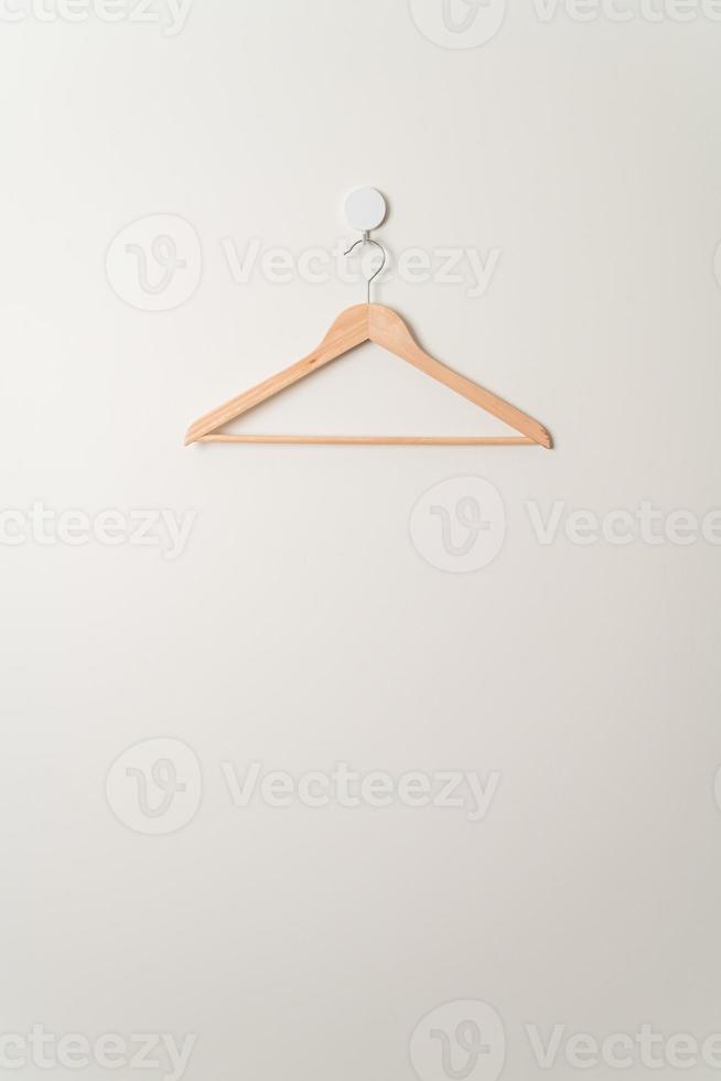 wood clothes hanger on wall photo