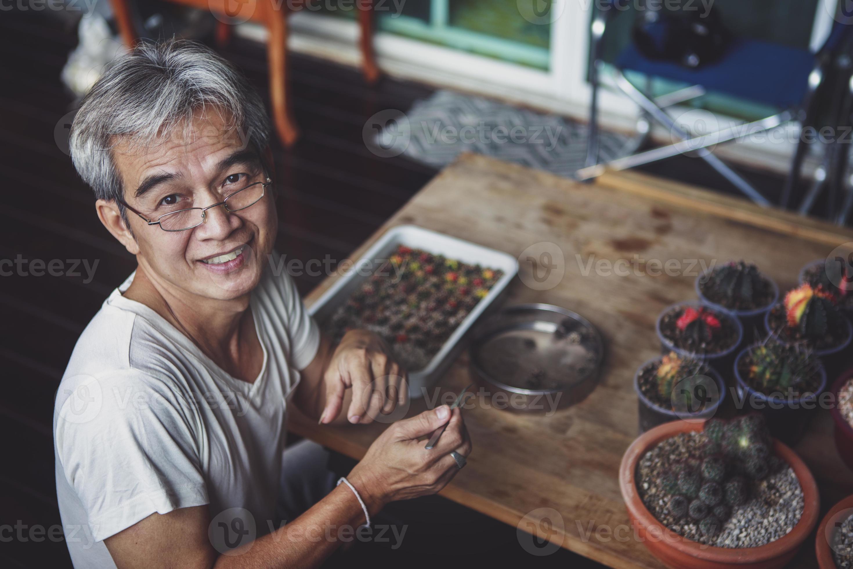 asian senior man taking care of cactus at home garden 5484198 Stock