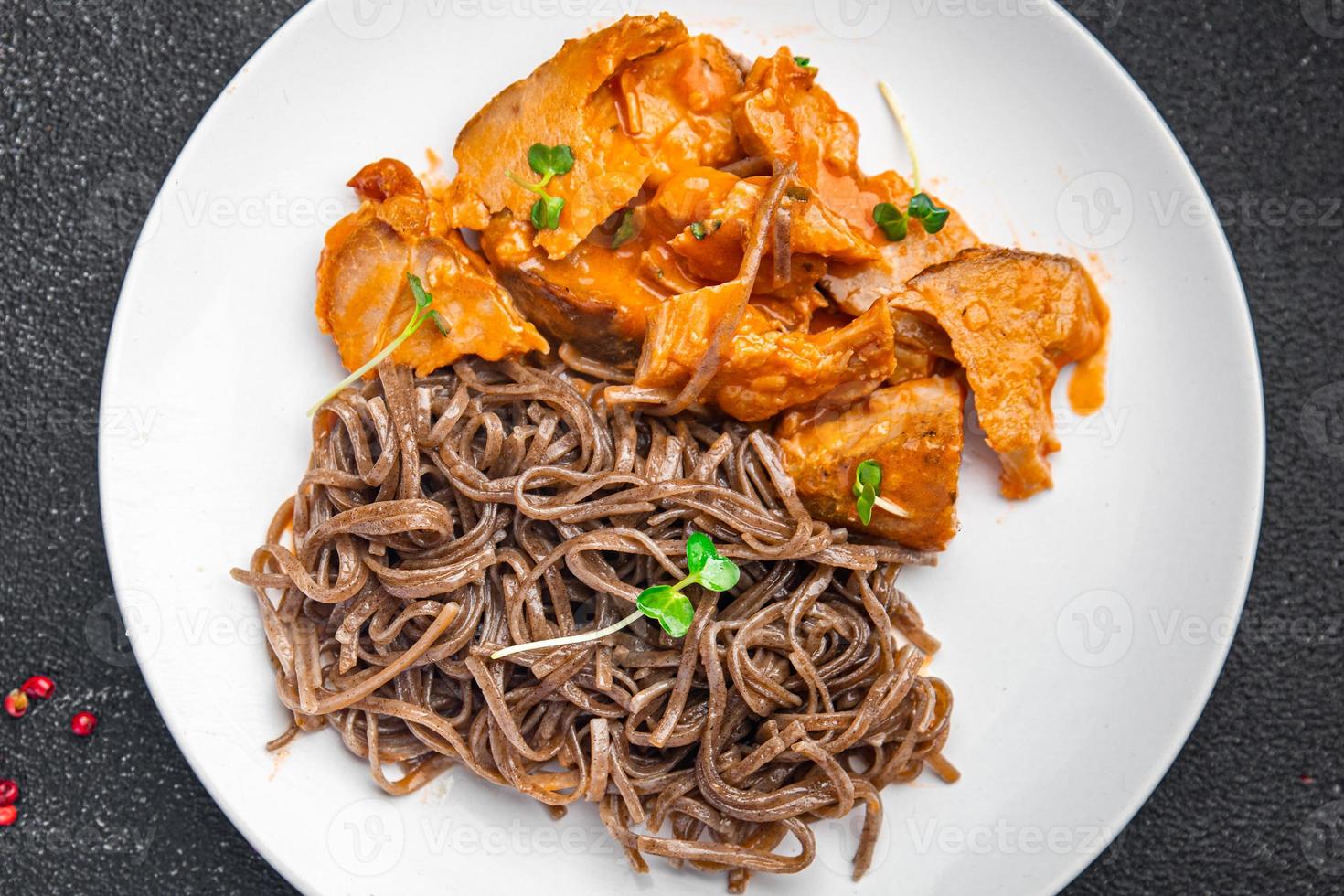 soba buckwheat noodles meat tomato sauce meal food snack on the table photo