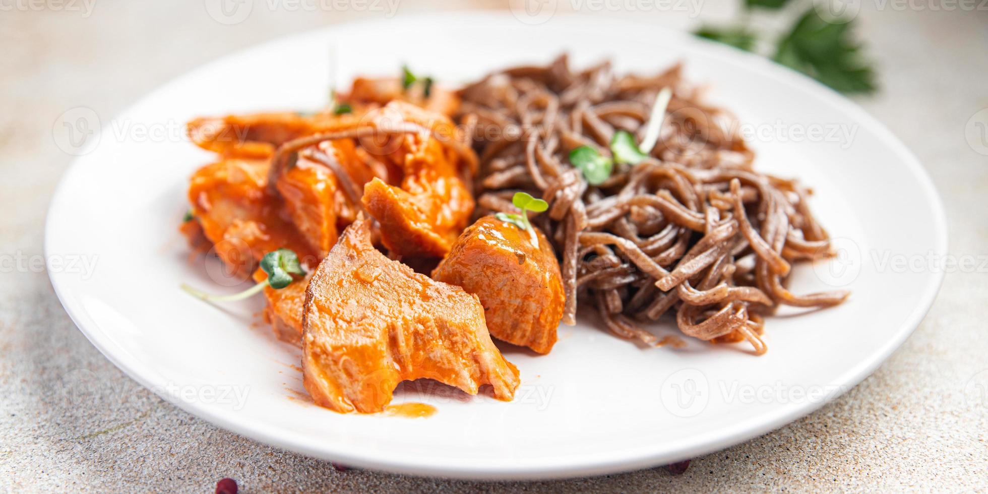 soba buckwheat noodles meat tomato sauce meal food snack on the table photo