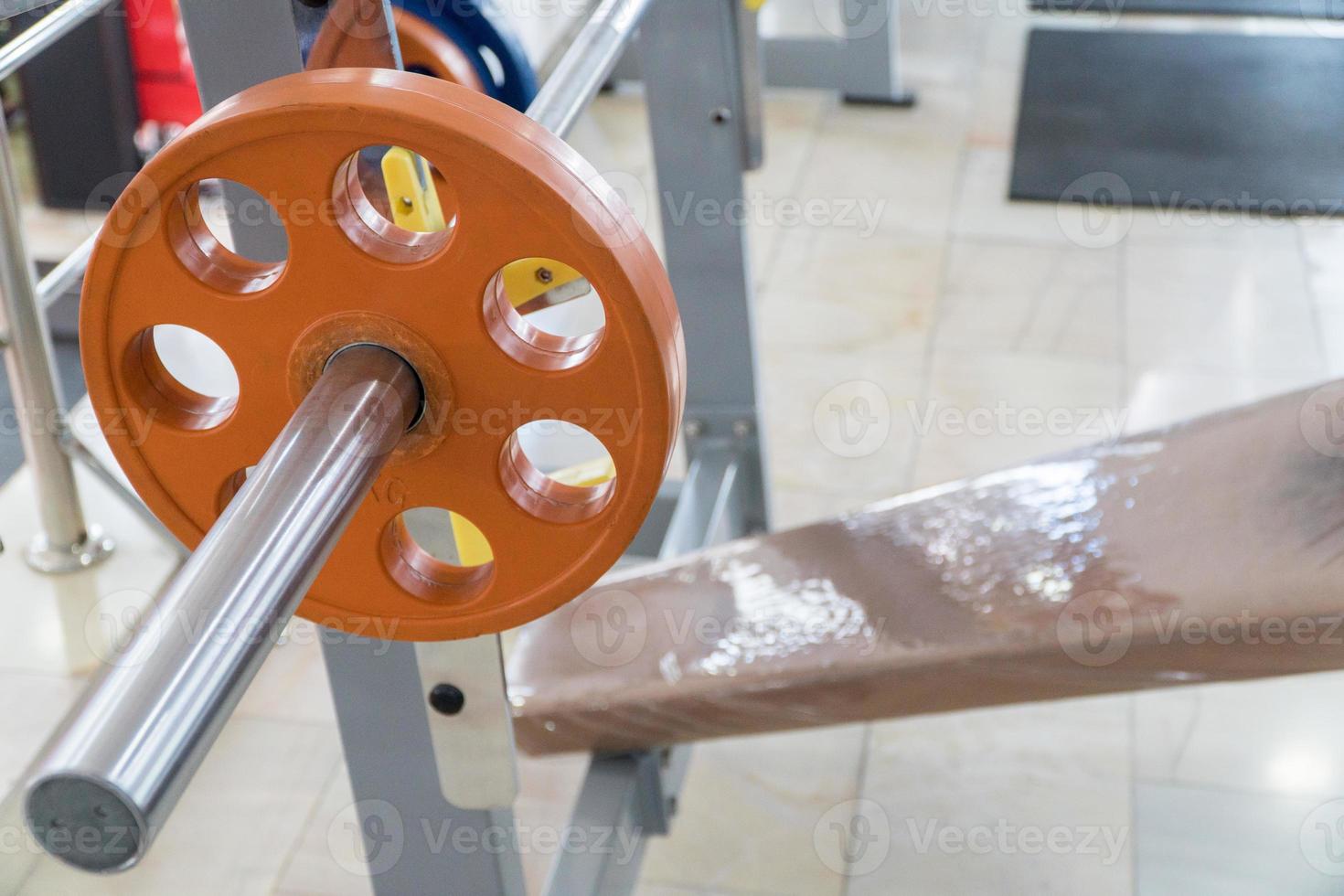 sports equipment and barbells in the gym photo