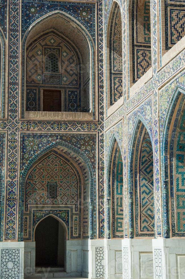 Arch and architecture of the ancient Registan in Samarkand. Ancient architecture of Central Asia photo