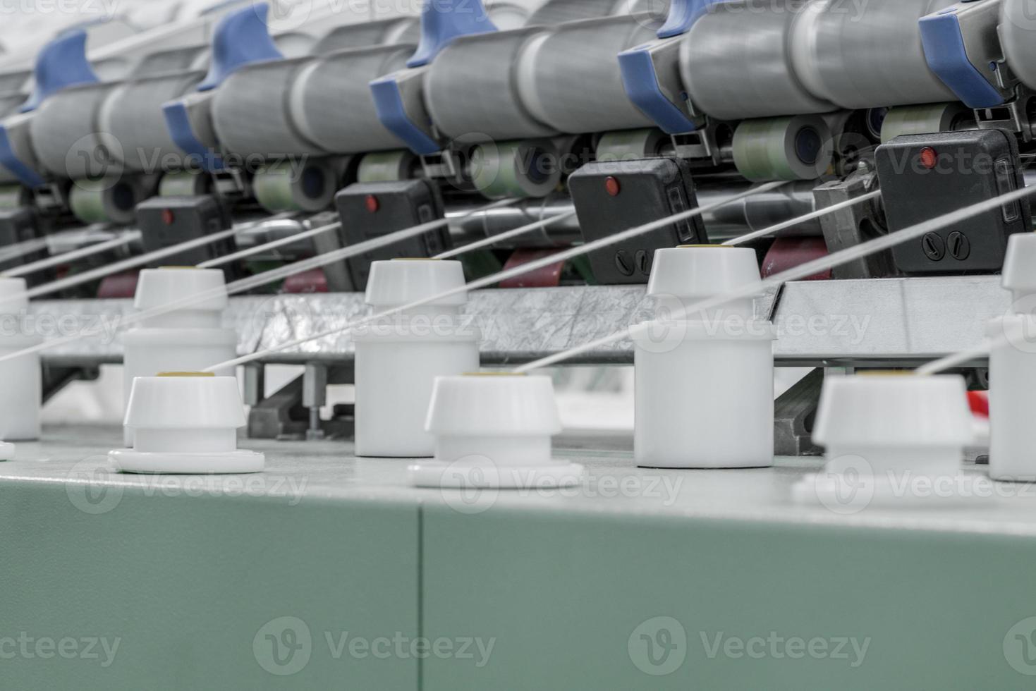 Machinery and equipment in the workshop for the production of thread. Industrial textile factory photo