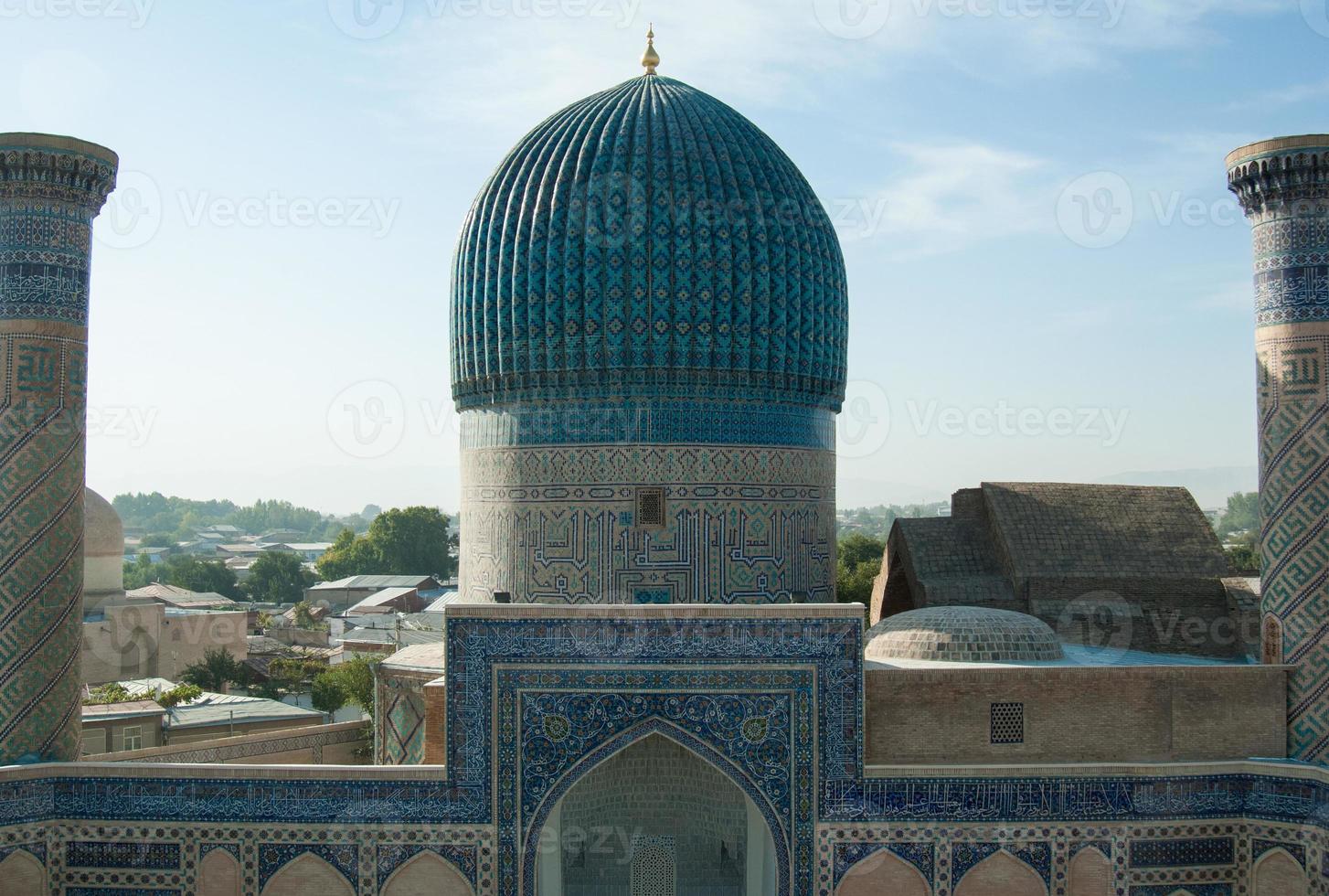 ancient Central Asian building with two columns and a tower. ancient architecture of Central Asia photo