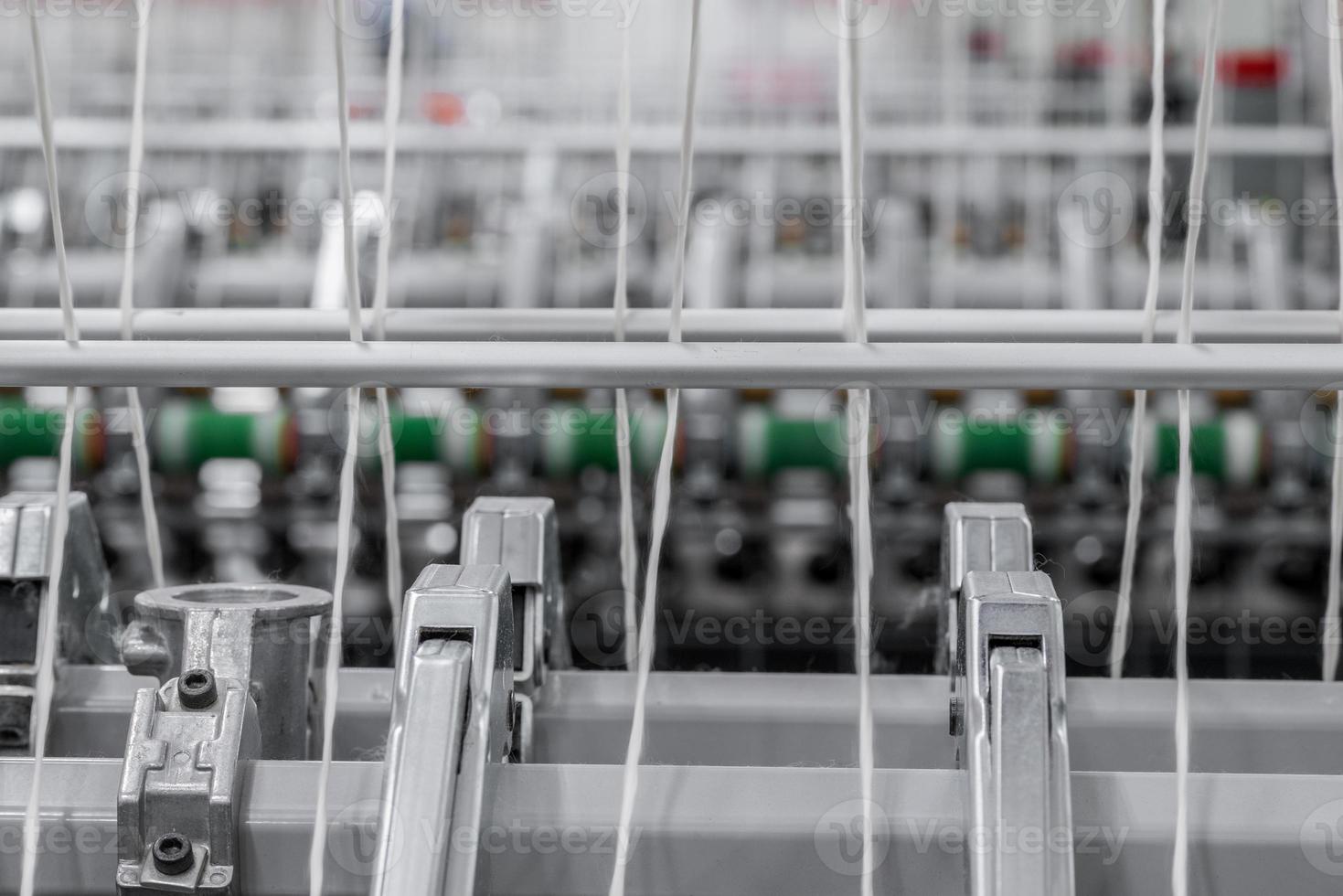 Machinery and equipment in the workshop for the production of thread. Industrial textile factory photo